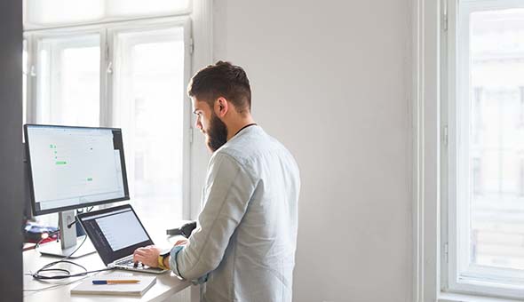 young-bearded-man-working-at-his-office-royalty-free-image-996080338-1543599599